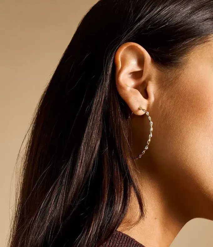 Pendientes de aro de acero inoxidable dorado con ojo turco de Sutton