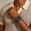 Reloj de acero inoxidable negro con tres agujas y fecha
