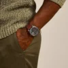Reloj de cuero marrón con tres agujas y fecha