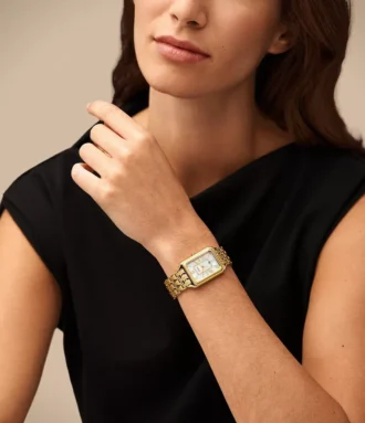 Reloj Raquel de acero inoxidable dorado con tres agujas y fecha